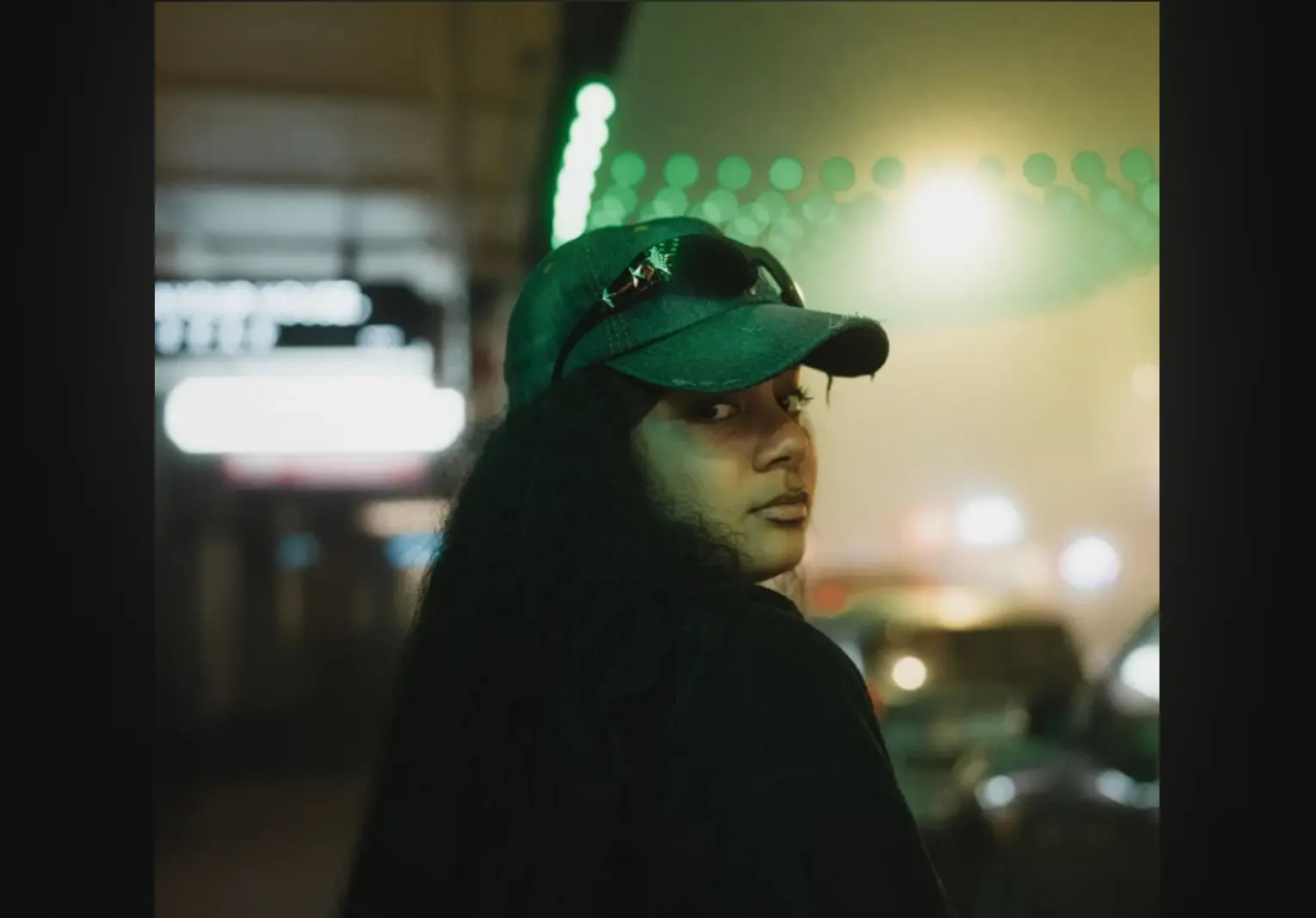 “Late Night Talking” by JUGA: An Addictive Joint Channeling Early Aughts and Modern R&B New Zealand alt R&B singer-songwriter JUGA pictured looking back at camera in a green hat with shades resting on top; cover art for "Late Night Talking"
