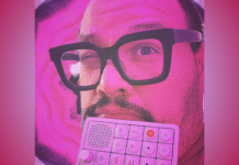 Frank Panduh’s “Cabbage” is a Delicious Slice of Manic Hyperpop Frank Panduh pictured with thick-framed glasses holding a white music production pad with a gradient pink backdrop; feature photo for a review of his single "Cabbage"