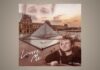 Jake Schroeder’s “Louvre Me” Builds a Monument Out of a Moment Singer-songwriter Jake Schroeder with a far, longing gaze and the Louvre museum in the background as cover art for his single "Louvre Me"
