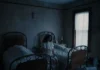 Mitski: How Our “Best American Girl” Forged a Music Career Beyond Asian-American Identity Politics Mitski in a still from the "If I Leave" music video dressed in Gothic nurse attire sitting between two beds.
