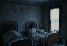 Mitski: How Our “Best American Girl” Forged a Music Career Beyond Asian-American Identity Politics Mitski in a still from the "If I Leave" music video dressed in Gothic nurse attire sitting between two beds.